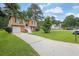 Charming two-story home with well-maintained lawn, landscaping, and a convenient attached garage at 5653 Bradley Cir, Lithonia, GA 30038