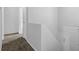 Hallway featuring new carpeting and a view of the front door at 5653 Bradley Cir, Lithonia, GA 30038