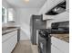 Well-lit kitchen with granite counters, stainless appliances, and ample cabinet space at 5653 Bradley Cir, Lithonia, GA 30038