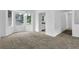 The open-concept living area features new carpeting and plenty of natural light at 5653 Bradley Cir, Lithonia, GA 30038