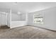 Bright, open living space features fresh paint, new carpeting, and lots of light at 5653 Bradley Cir, Lithonia, GA 30038