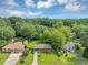 Aerial shot showcasing a charming home with lush landscaping and mature trees in a serene neighborhood at 701 Green Acres Se Rd, Smyrna, GA 30080