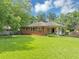 Spacious backyard featuring a well-maintained lawn and chain-link fence at 701 Green Acres Se Rd, Smyrna, GA 30080