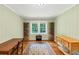 Dining area with hardwood floors, natural lighting, and custom wine storage at 701 Green Acres Se Rd, Smyrna, GA 30080