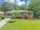 Attractive single-story brick home with an inviting front lawn and a convenient attached carport at 701 Green Acres Se Rd, Smyrna, GA 30080