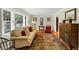 Bright living room with hardwood floors, large windows, and a comfortable seating area at 701 Green Acres Se Rd, Smyrna, GA 30080