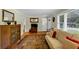 Comfortable living room with hardwood floors, large windows, and neutral wall paint at 701 Green Acres Se Rd, Smyrna, GA 30080