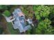 Aerial view of sprawling property with pool, covered patio, and lush landscaping at 114 Trinity Hollow Dr, Canton, GA 30115