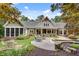 Stunning backyard featuring a luxurious pool, lush garden, and ample patio space at 114 Trinity Hollow Dr, Canton, GA 30115