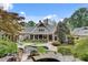 Expansive backyard with a pool, patio, and a well-manicured lawn at 114 Trinity Hollow Dr, Canton, GA 30115