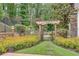 Beautiful landscaped backyard garden with stone walking path at 114 Trinity Hollow Dr, Canton, GA 30115