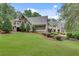 Expansive green lawn in the backyard, showcasing landscaping and the home's exterior at 114 Trinity Hollow Dr, Canton, GA 30115