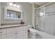 Clean bathroom featuring a combination shower and tub, white vanity with granite countertop, and a decorative mirror at 114 Trinity Hollow Dr, Canton, GA 30115
