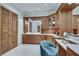 Bathroom featuring double sink vanity, custom wood cabinets, and tile floors at 114 Trinity Hollow Dr, Canton, GA 30115