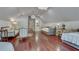 A spacious bedroom features hardwood floors, two beds, and a hallway leading to a bathroom at 114 Trinity Hollow Dr, Canton, GA 30115