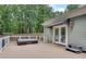 Outdoor deck with a hot tub and seating area, perfect for relaxation and entertaining at 114 Trinity Hollow Dr, Canton, GA 30115