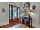 Grand entryway featuring decorative table with lamps and mirror at 114 Trinity Hollow Dr, Canton, GA 30115