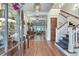 Elegant foyer with hardwood floors, staircase, and coffered ceiling leading into the living space at 114 Trinity Hollow Dr, Canton, GA 30115