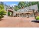 Traditional home with large driveway, three-car garage, and basketball hoop at 114 Trinity Hollow Dr, Canton, GA 30115
