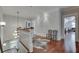 Hallway with hardwood floors, decorative lighting, and view down to the lower level at 114 Trinity Hollow Dr, Canton, GA 30115