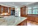Modern gourmet kitchen with granite countertops, custom cabinets, and high-end stainless steel appliances at 114 Trinity Hollow Dr, Canton, GA 30115