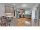 A neutral kitchen design offers stainless steel appliances, a breakfast bar, and wooden floors at 114 Trinity Hollow Dr, Canton, GA 30115