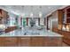 Open-concept kitchen featuring a large center island with breakfast bar and granite countertops at 114 Trinity Hollow Dr, Canton, GA 30115