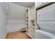 Well-lit laundry area with washer, dryer and custom shelves for added storage at 114 Trinity Hollow Dr, Canton, GA 30115