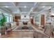 Elegant living room boasting hardwood floors, coffered ceilings, fireplace and neutral color palette at 114 Trinity Hollow Dr, Canton, GA 30115