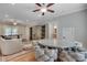 Open living area with hardwood floors, modern furnishings, a decorative cabinet, and views of a dining area at 114 Trinity Hollow Dr, Canton, GA 30115