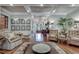 Stylish living room featuring hardwood floors, coffered ceiling, and seamless flow to the foyer at 114 Trinity Hollow Dr, Canton, GA 30115