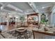 Bright living room with hardwood floors, coffered ceiling, and an open floor plan to kitchen at 114 Trinity Hollow Dr, Canton, GA 30115