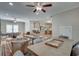 An open-concept living space features multiple seating areas, a dining table, and a kitchen at 114 Trinity Hollow Dr, Canton, GA 30115