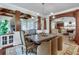 Open-concept living and dining areas with beautiful wood trim, stone fireplace, and plenty of natural light at 114 Trinity Hollow Dr, Canton, GA 30115