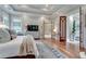 Spacious main bedroom with tray ceiling, hardwood floors and leading into bathroom at 114 Trinity Hollow Dr, Canton, GA 30115