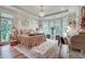 Luxurious main bedroom with many windows, a decorative rug, chandelier and tray ceiling at 114 Trinity Hollow Dr, Canton, GA 30115