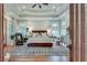 Spacious main bedroom with tray ceiling, hardwood floors and outdoor patio access at 114 Trinity Hollow Dr, Canton, GA 30115