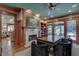 Well-appointed office space with wood details, fireplace, and backyard views at 114 Trinity Hollow Dr, Canton, GA 30115
