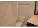 Bathroom featuring a toilet and bathtub with tile flooring and a sleek modern design at 1530 Horseshoe Creek Ln, Cumming, GA 30041