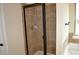 Tiled shower stall with glass door, chrome fixtures, and adjacent bathtub at 1530 Horseshoe Creek Ln, Cumming, GA 30041