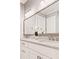 Contemporary bathroom featuring marble countertops, dual sinks, and a large mirror at 1993 Haley Walk, Atlanta, GA 30318