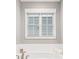 Bright bathroom features natural light and white subway tile extending from the bathtub at 1993 Haley Walk, Atlanta, GA 30318