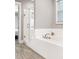 Modern bathroom featuring soaking tub and a separate glass enclosed shower at 1993 Haley Walk, Atlanta, GA 30318