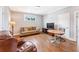 Inviting bonus room with a comfy sofa, hardwood floors, and a large window, a great space for entertaining at 1993 Haley Walk, Atlanta, GA 30318