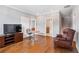 Entertainment area with a TV, stylish seating, hardwood floors, and an open layout, ideal for gatherings at 1993 Haley Walk, Atlanta, GA 30318
