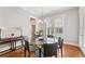 Sunny dining area with glass table, hardwood floors, and lots of natural light at 1993 Haley Walk, Atlanta, GA 30318