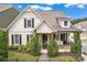 Charming two-story home with board and batten siding, black shutters, and craftsman-style details at 1993 Haley Walk, Atlanta, GA 30318