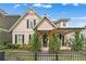 Charming two-story home with board and batten siding, black shutters, and craftsman-style details at 1993 Haley Walk, Atlanta, GA 30318