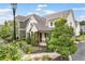 Exterior view of charming townhome, featuring manicured landscaping and inviting front porch at 1993 Haley Walk, Atlanta, GA 30318