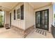 Covered entrance with brick detail and black double doors create a warm welcome at 1993 Haley Walk, Atlanta, GA 30318